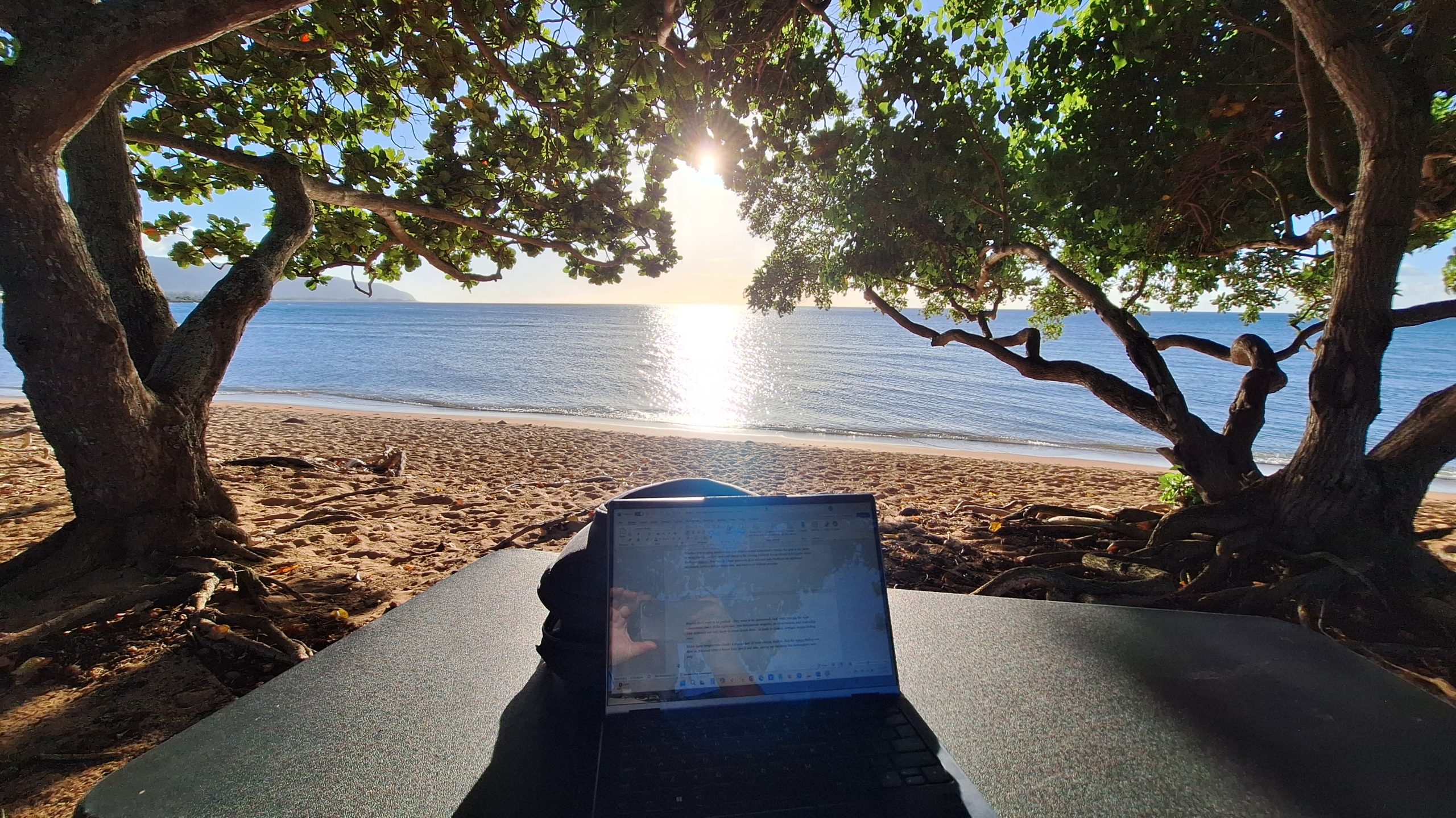 Scott Sylvan Bell working from the beach — North Shore Oahu — business consulting in paradise